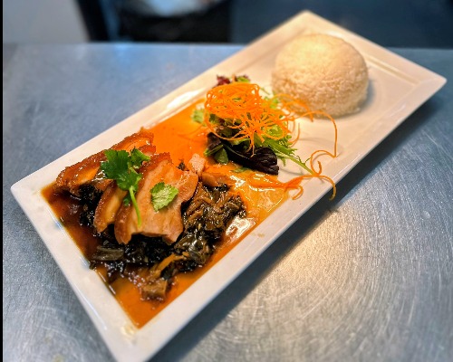 Braised pork belly with preserved vegetables on rice
