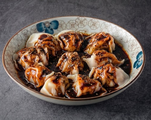 DUMPLINGS IN BLACK PEPPER SAUCE 黑椒酱饺子